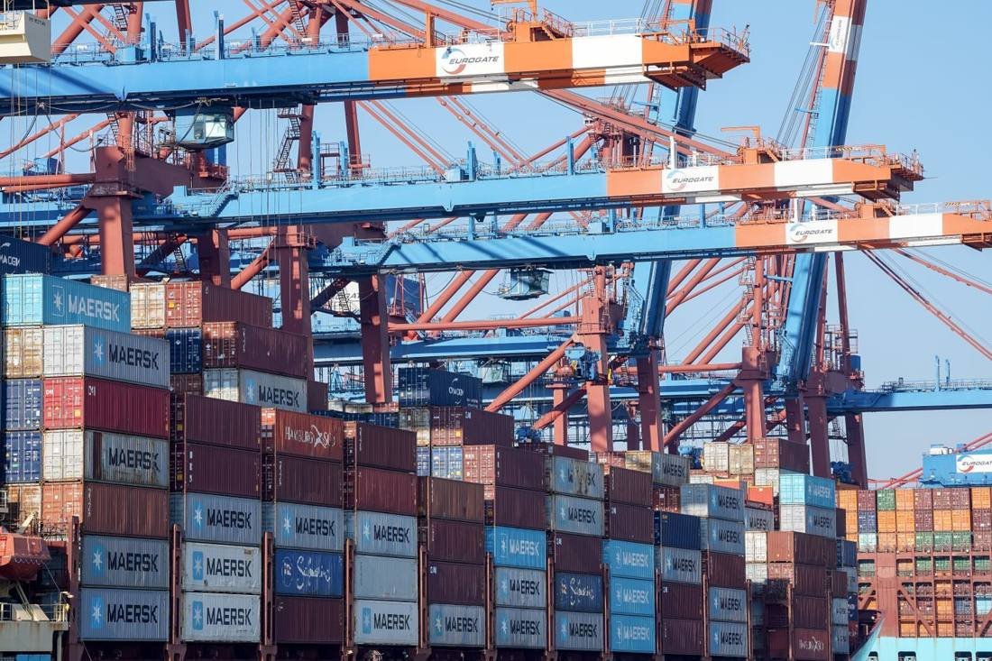 Shipping containers at a European port, representing logistics into Europe